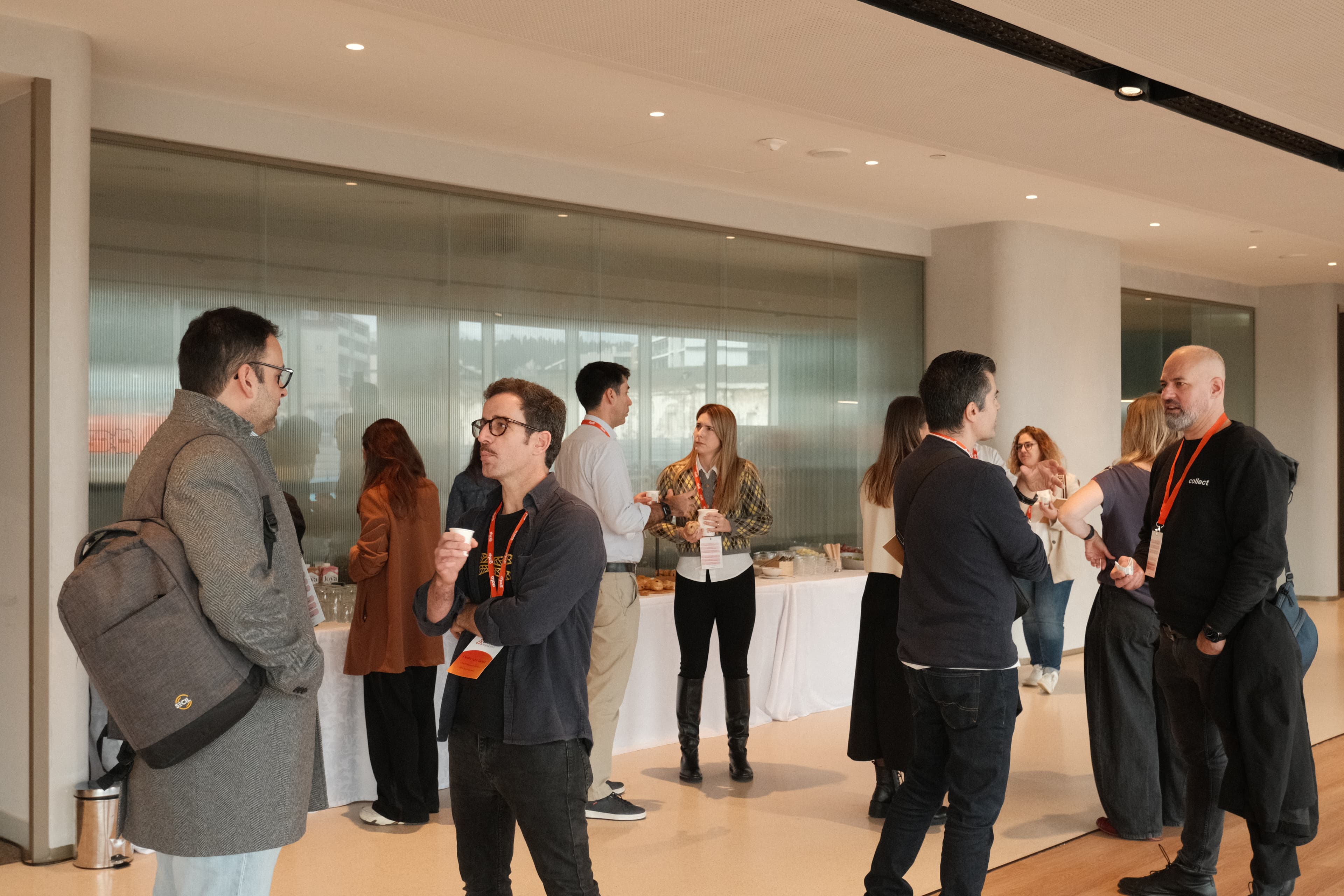 Participants in a focused networking conversation during a Product Circle event.