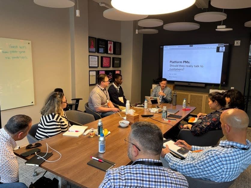 Session around a table led by Steven at a Product Circle event.
